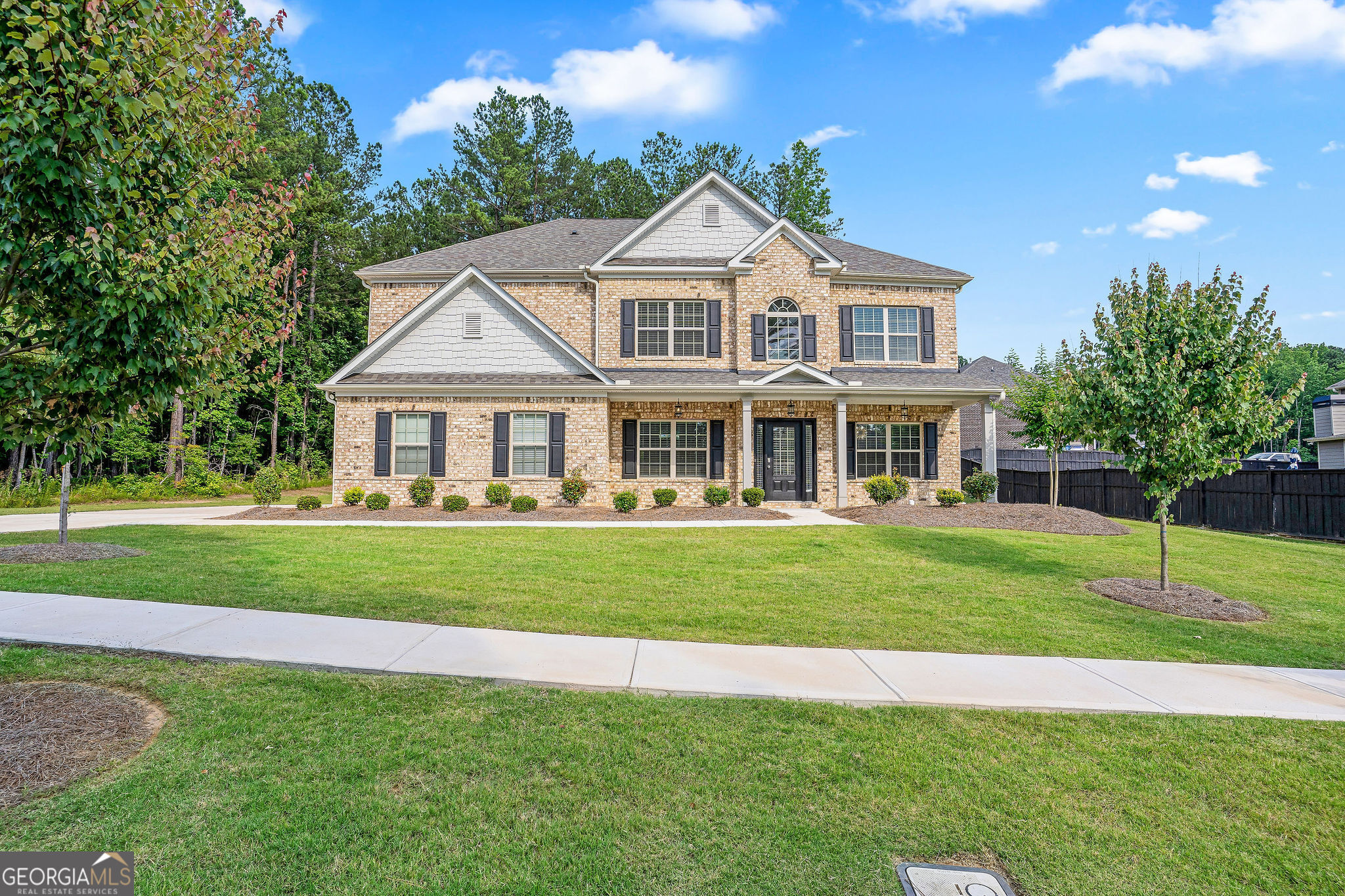 a front view of a house with a yard