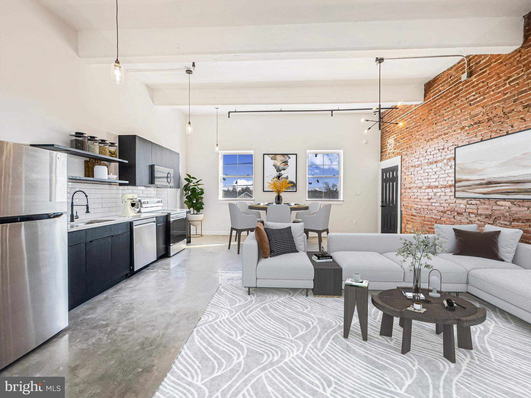 a living room with furniture kitchen view and a chandelier