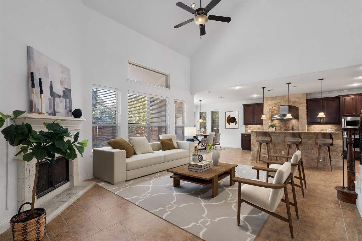 a living room with furniture and flowers