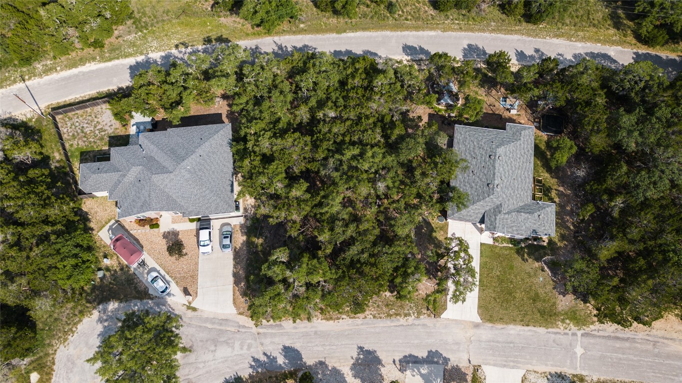 an aerial view of a house with a swimming pool