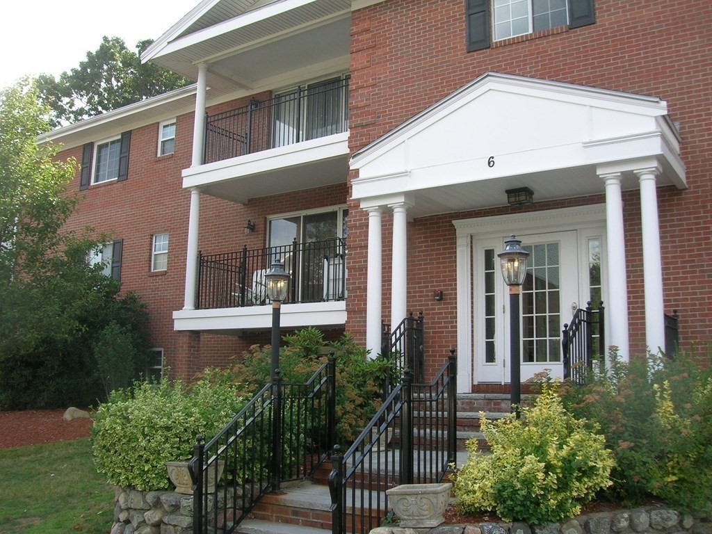 front view of a house with a small yard