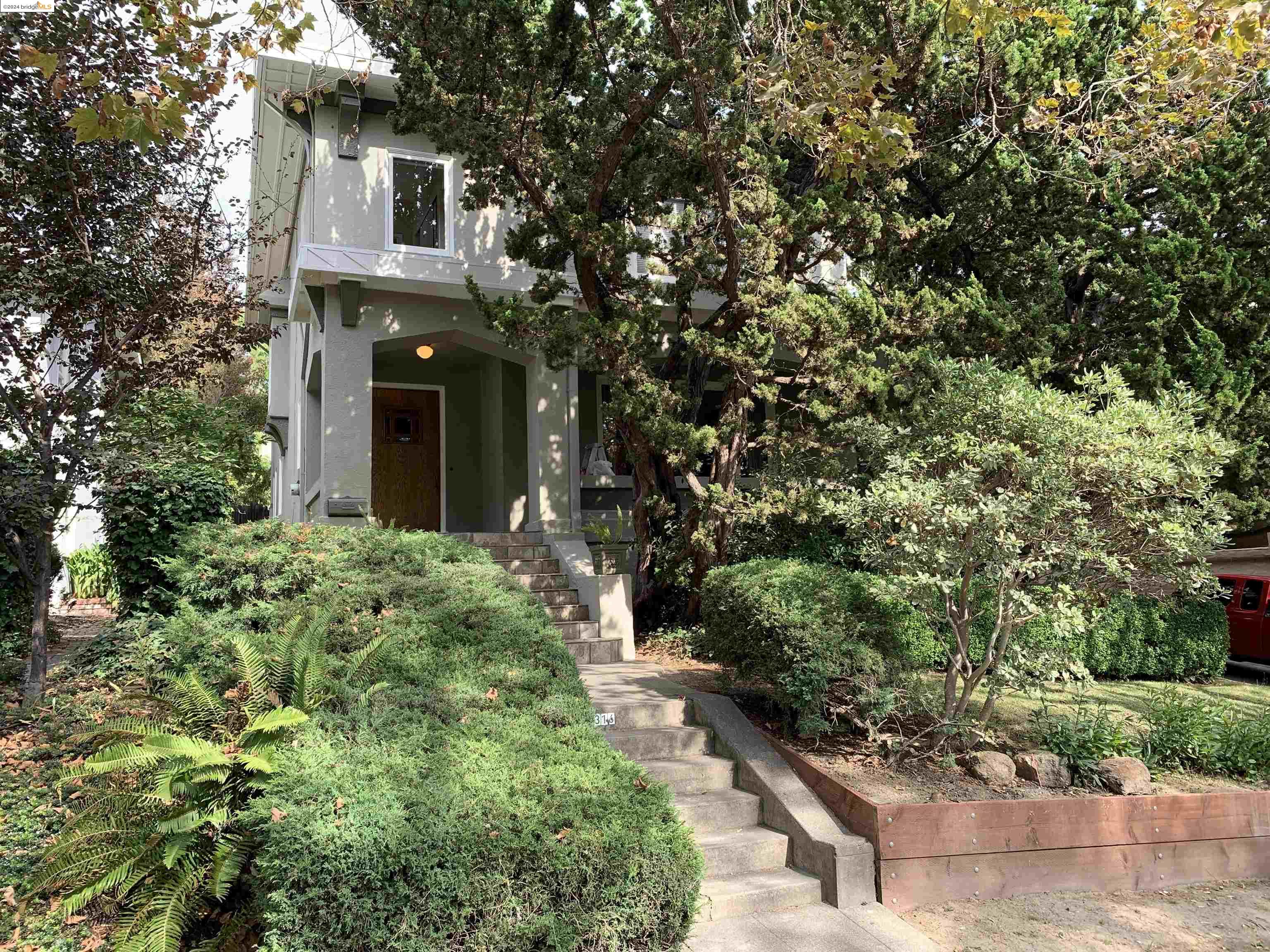 a view of a house with a tree