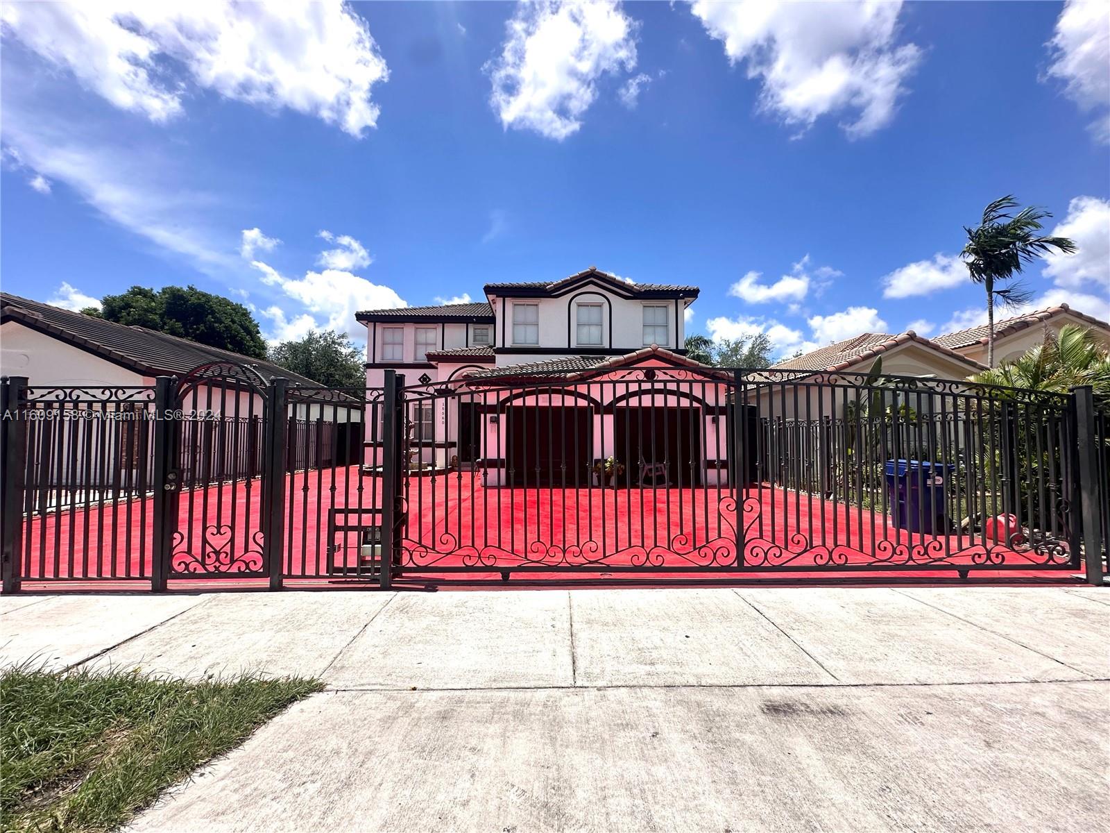 a view of a wrought iron fences in front of house