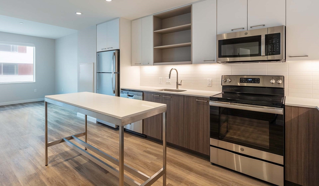 a kitchen with a stove and a microwave