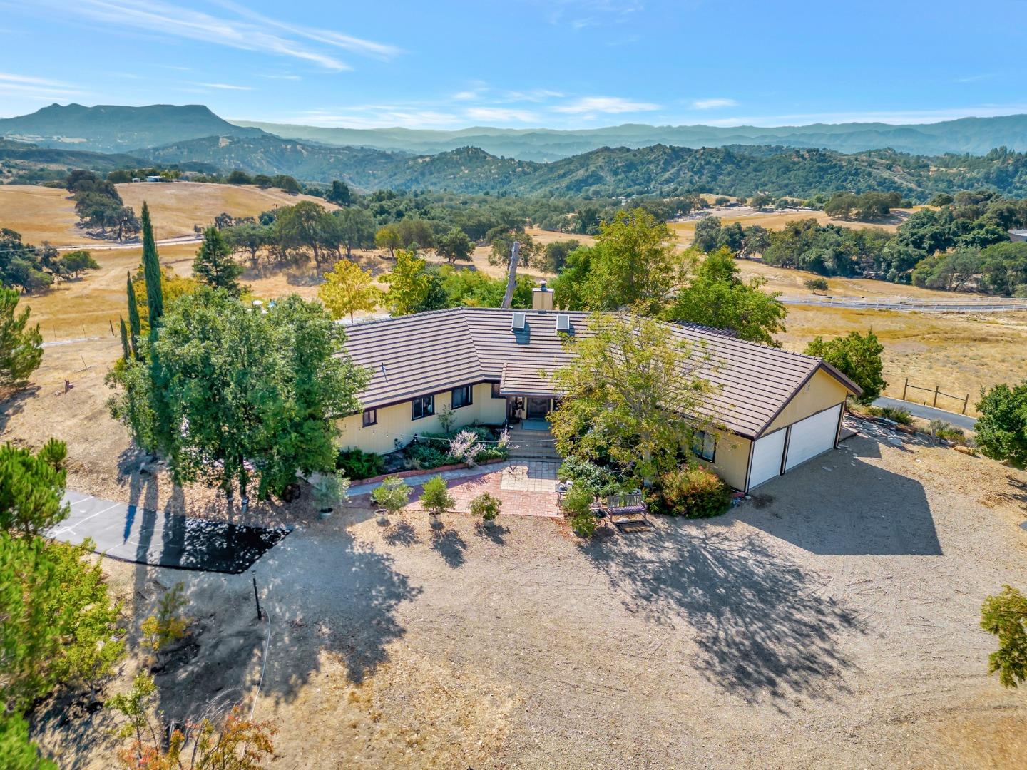 an aerial view of a house with a lake view