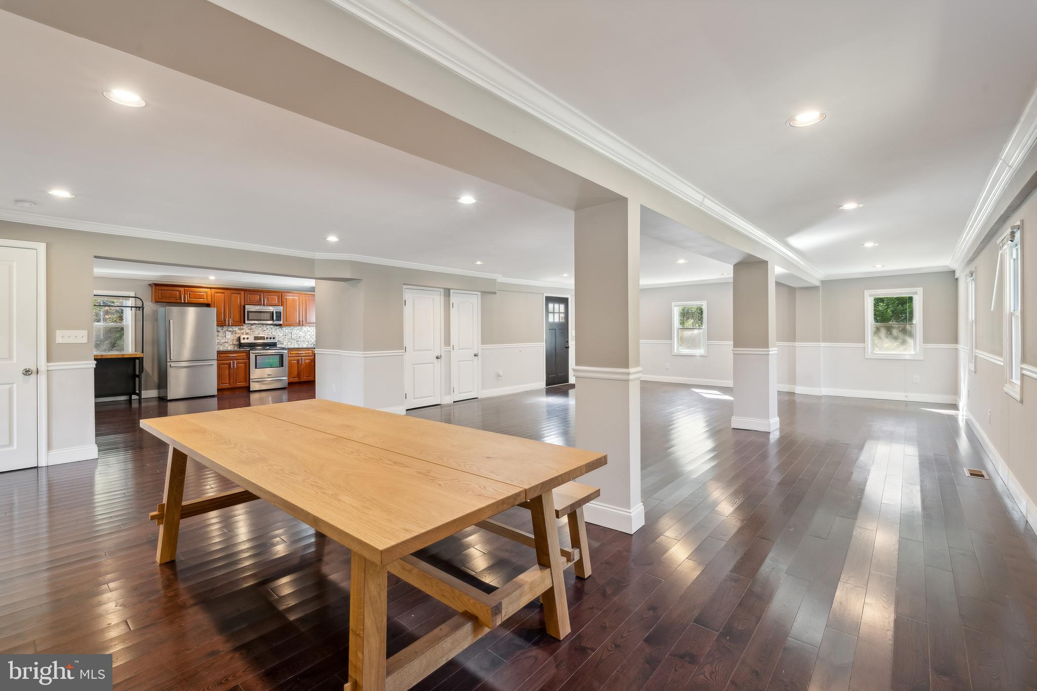 a view of a dining room with furniture and wooden floor