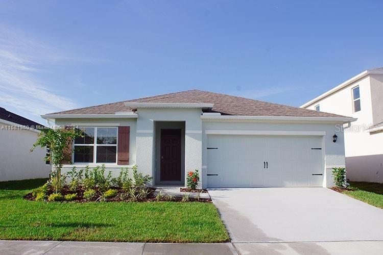 a front view of house with a yard