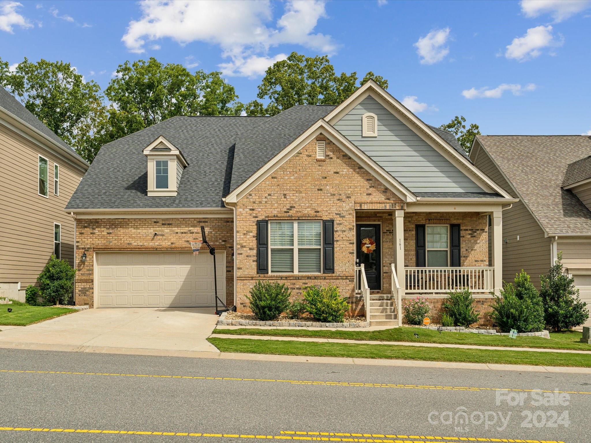 front view of a house with a yard