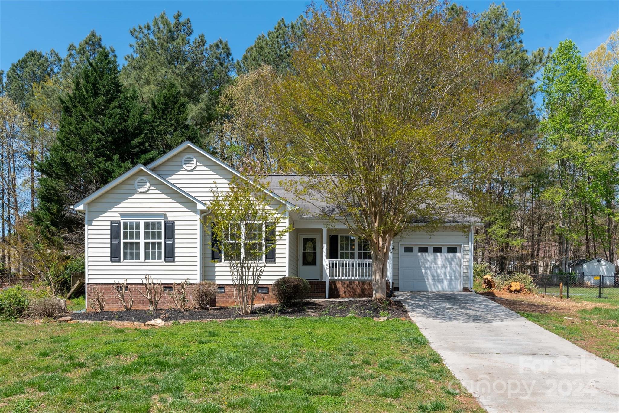 front view of a house with a yard