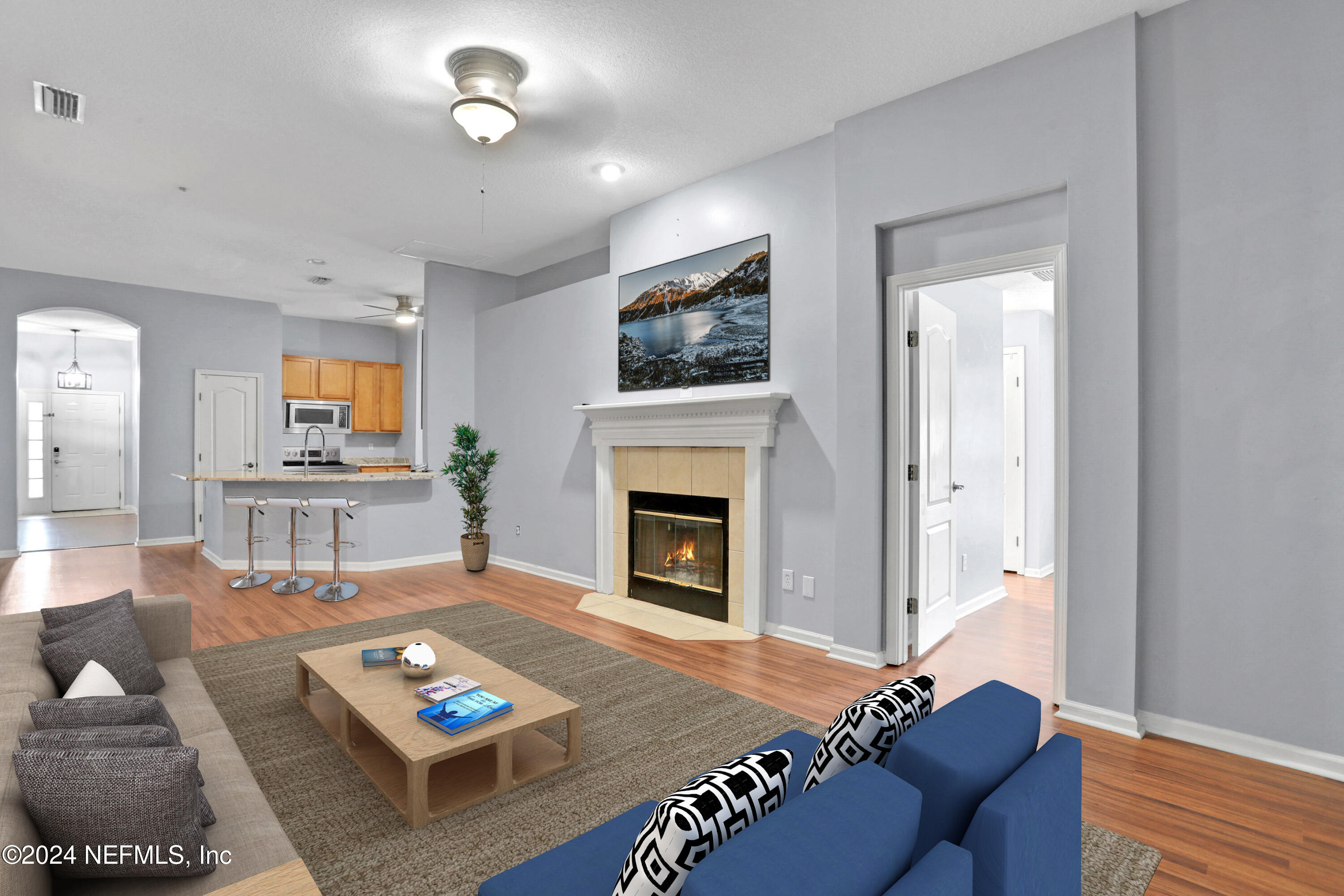 a living room with furniture and a fireplace