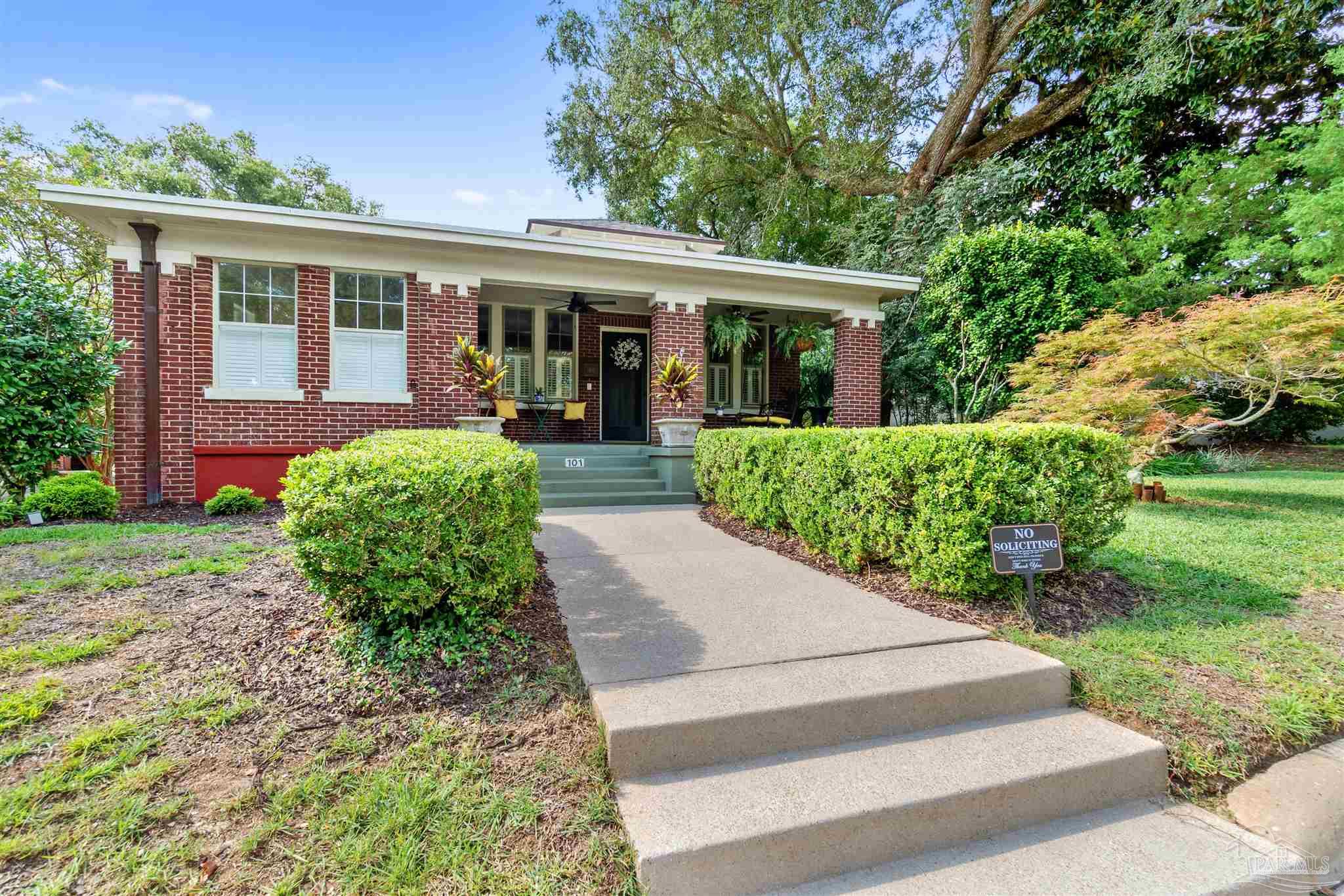 front view of a house with a yard