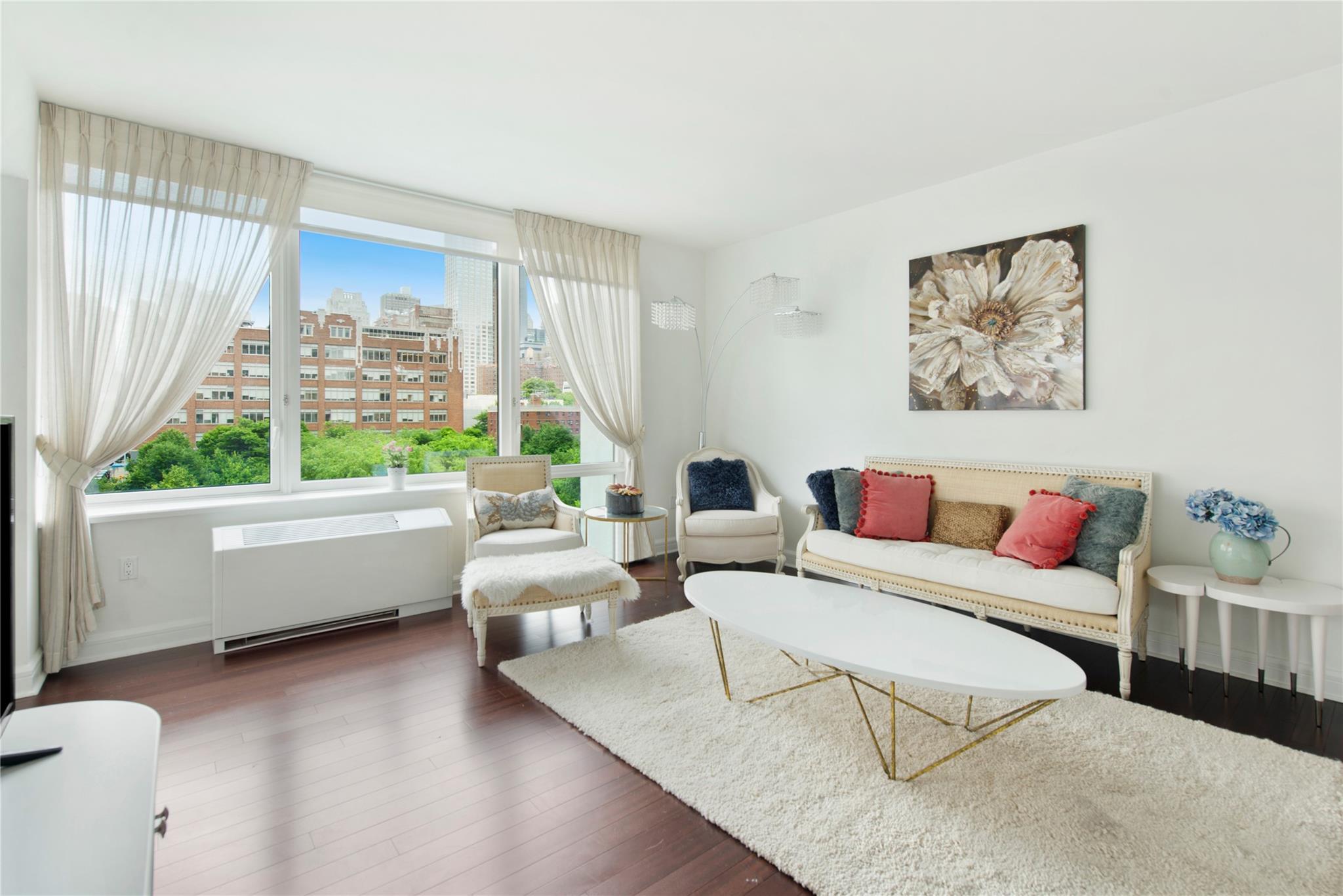 Living room featuring dark hardwood / wood-style floors and radiator