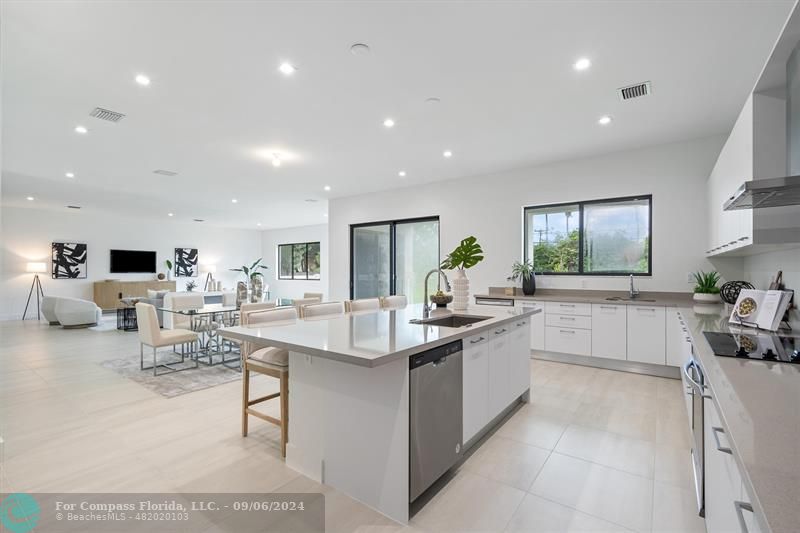 a kitchen with counter top space appliances and cabinets