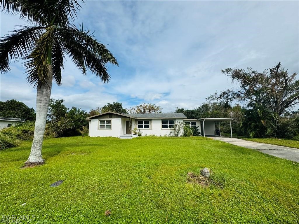 a view of a house with a big yard