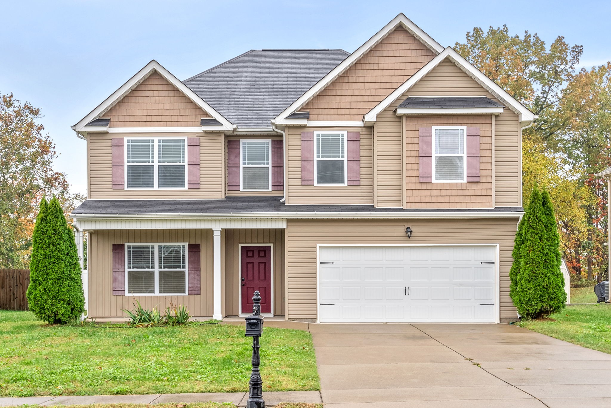 front view of a house with a yard