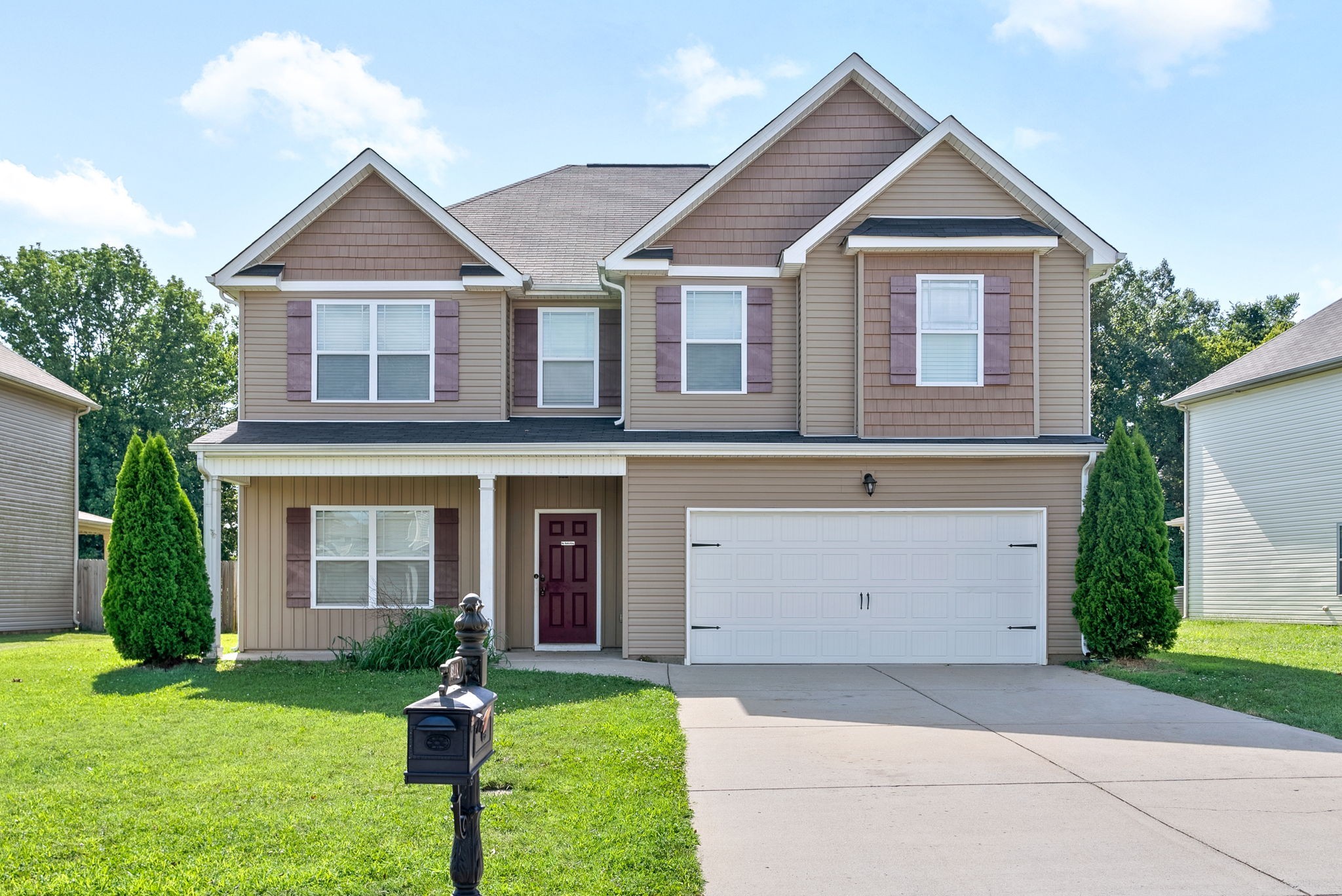 front view of a house with a yard