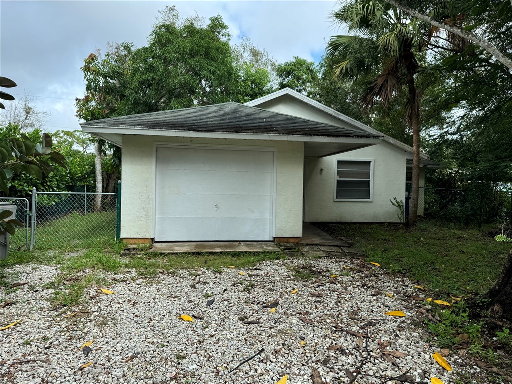 a house with trees in the background