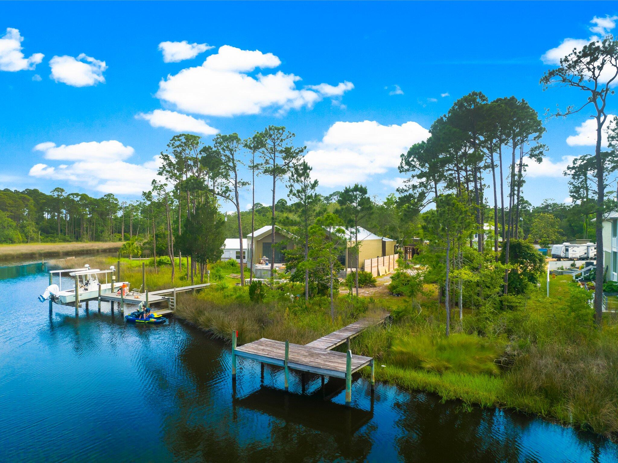 a view of a lake with a yard