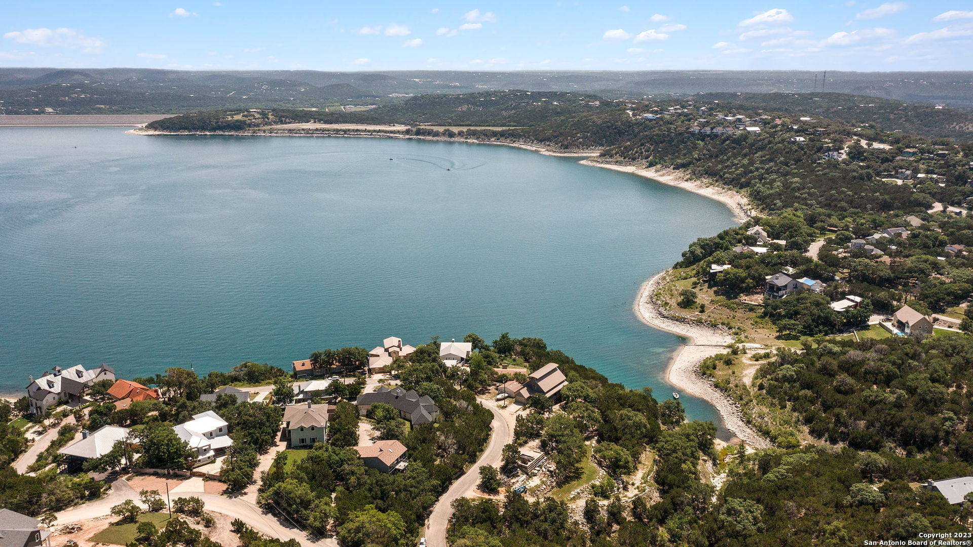 an aerial view of a houses with ocean view