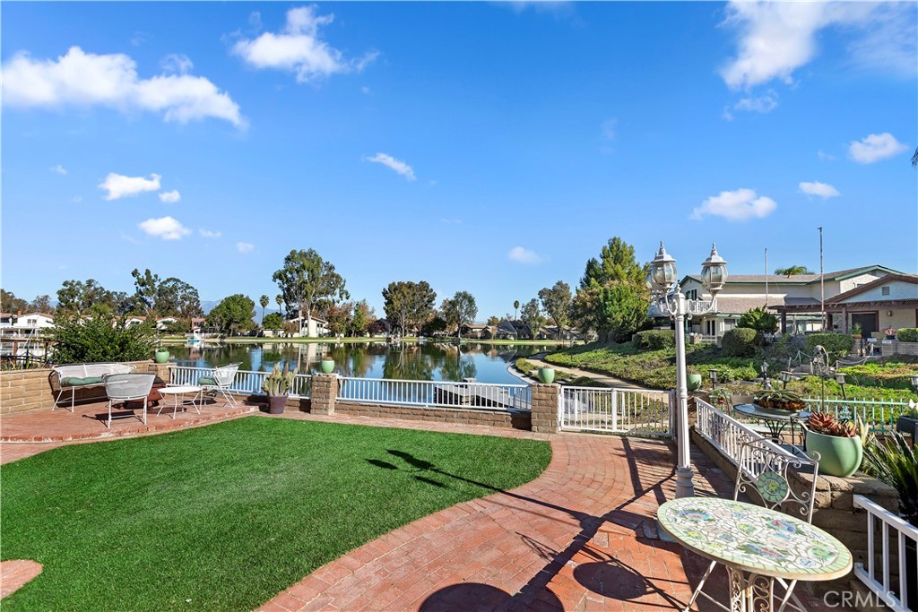 a view of a backyard with sitting area