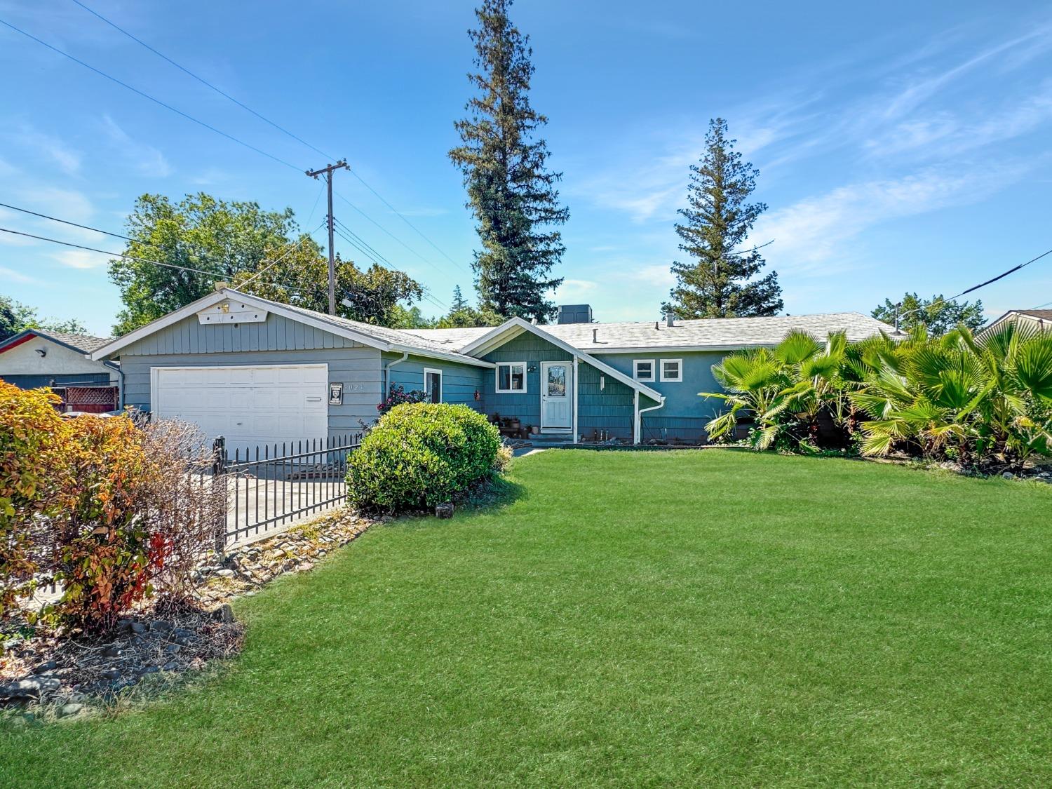 a view of a house with a garden