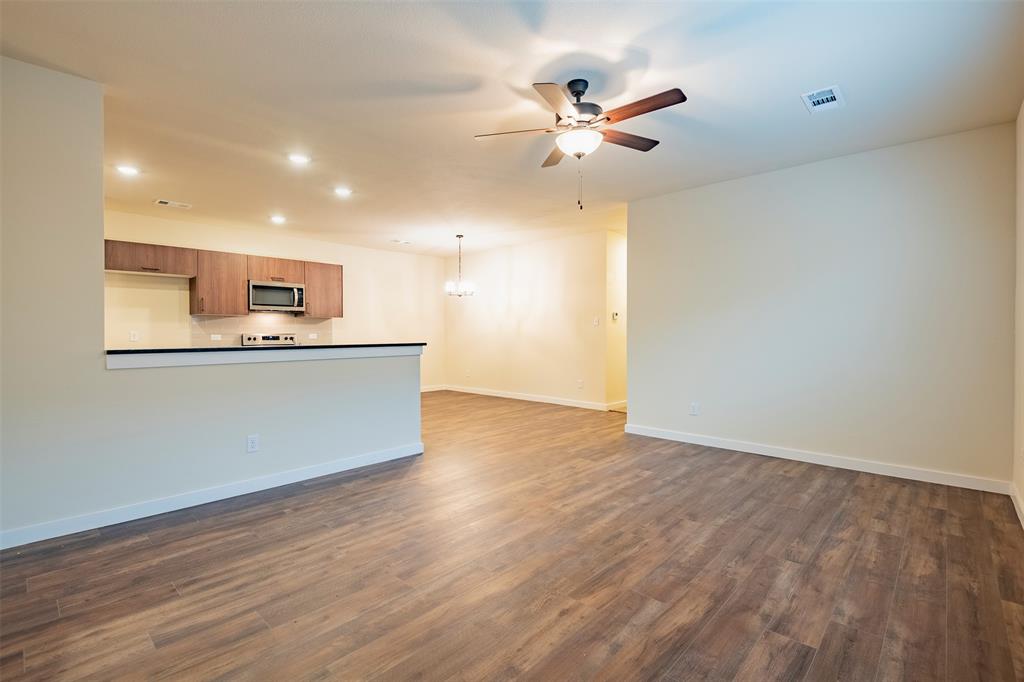 a view of a kitchen with a sink and a window