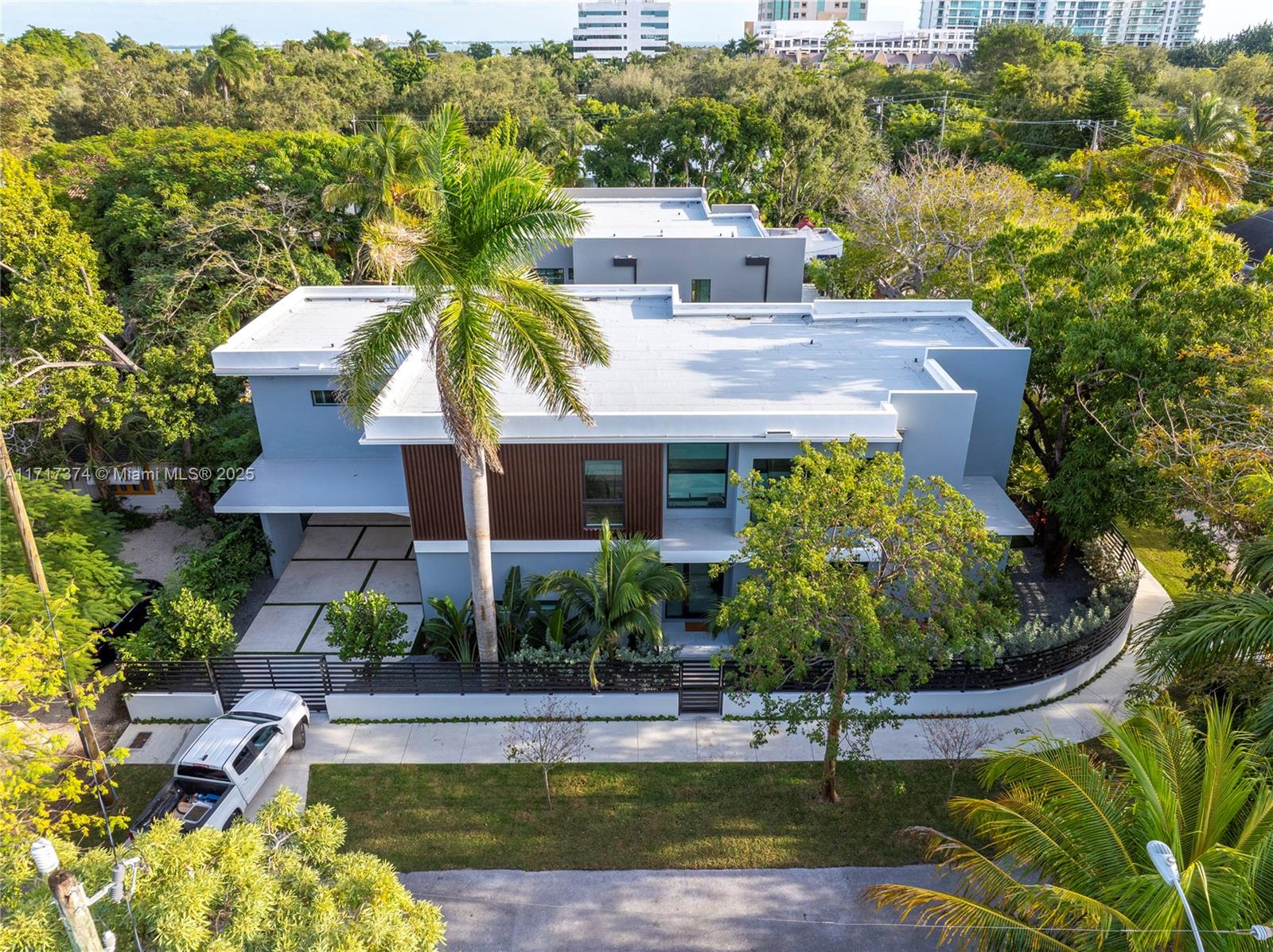 a view of house with yard and swimming pool