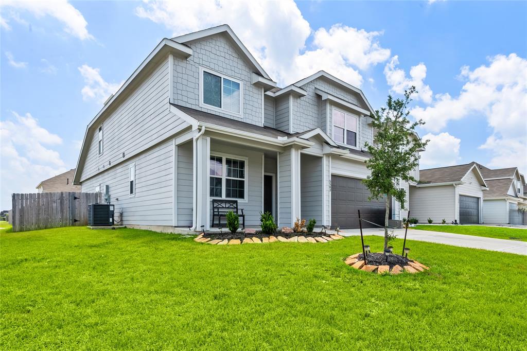 a front view of house with yard and green space