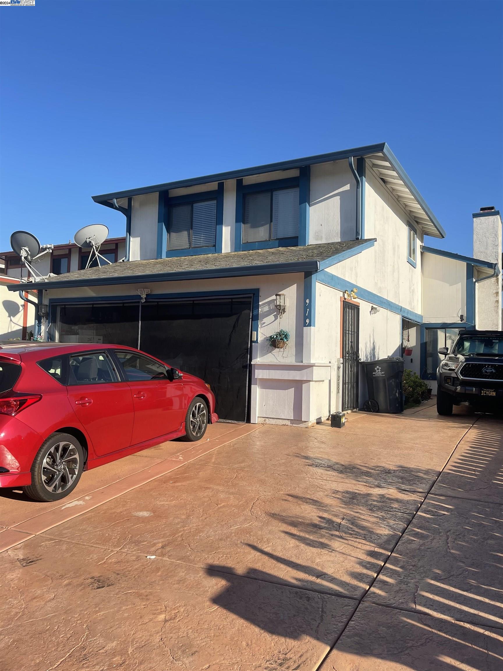 a front view of a house with parking space