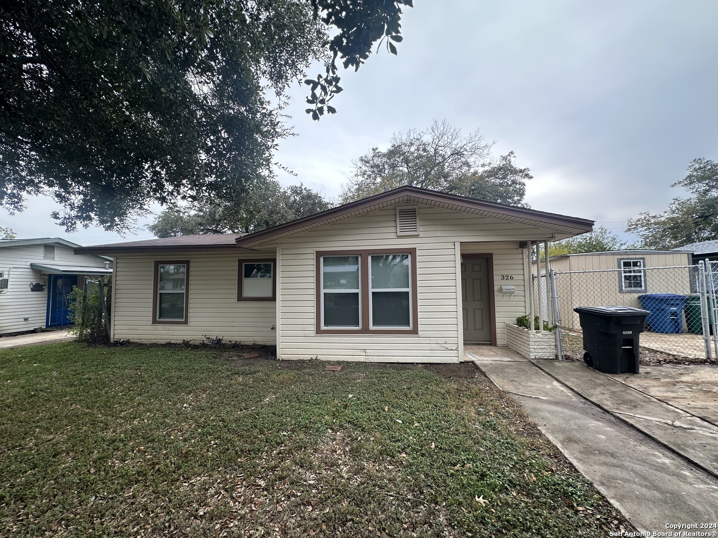 front view of a house with a yard