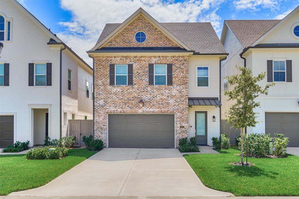 Welcome home to 2033 Carlson Creek in the quaint, gated enclave of The Reserve at Woodmill Creek!