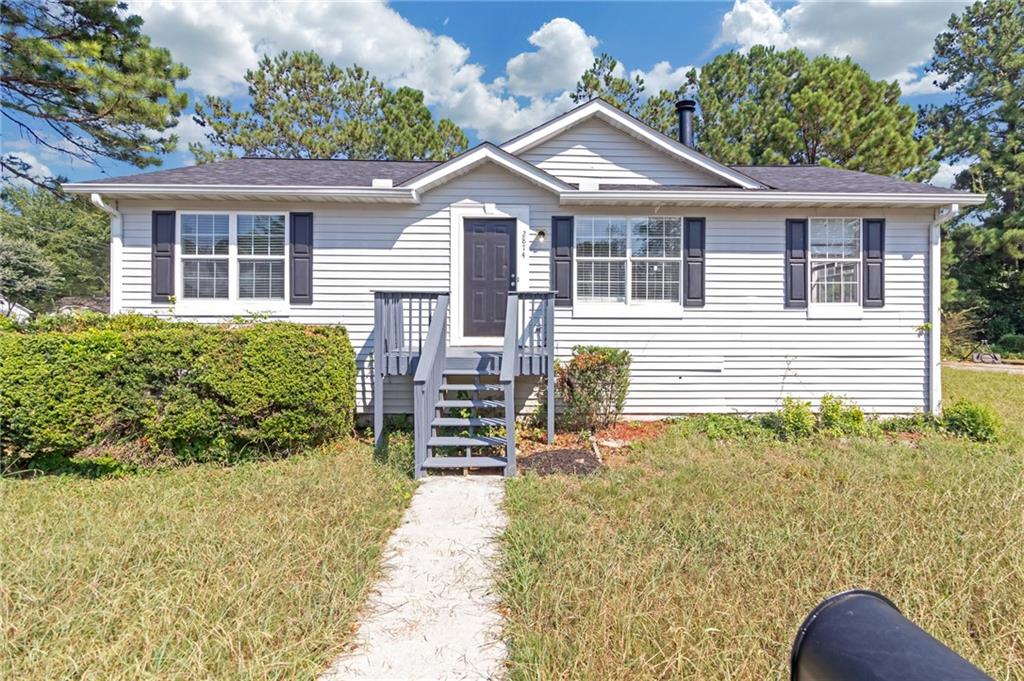 front view of a house with a yard