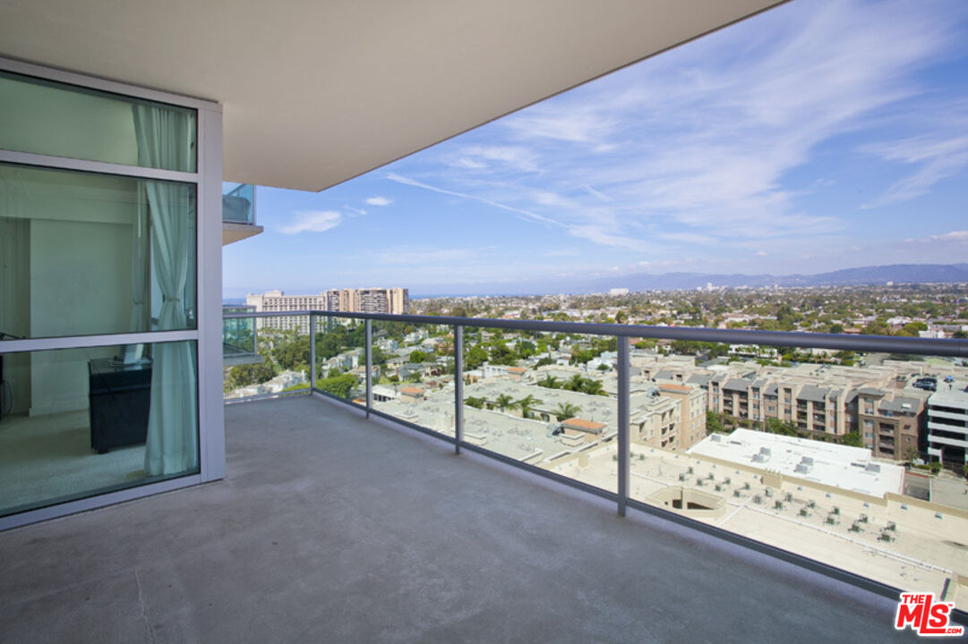 a view of a balcony with city view