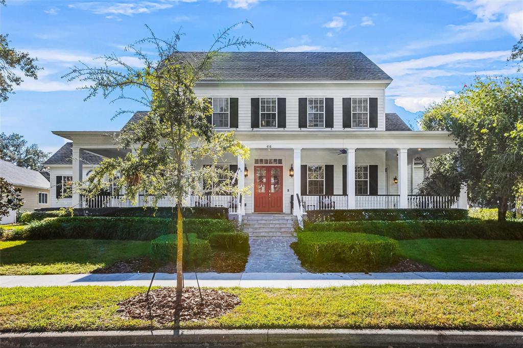 a front view of a house with garden