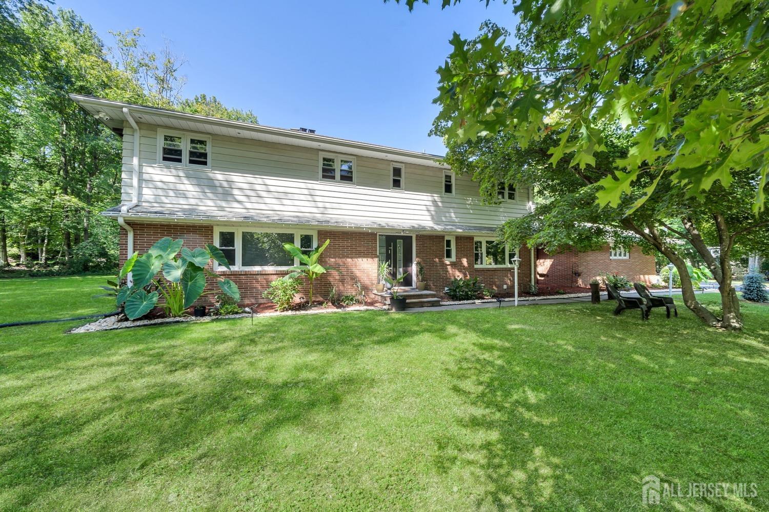 a view of a house with a yard porch and sitting area