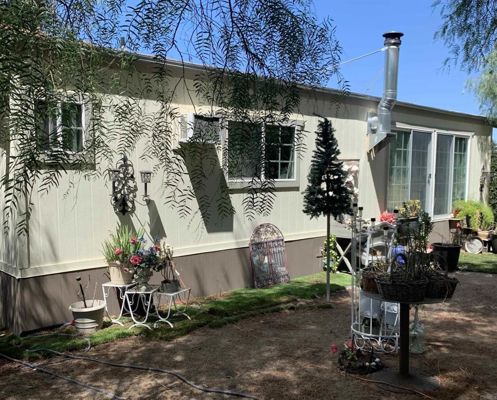 a front view of a house with sitting area