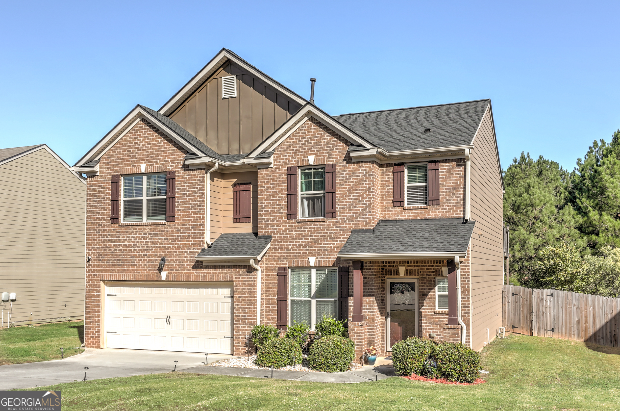 a front view of a house with garden