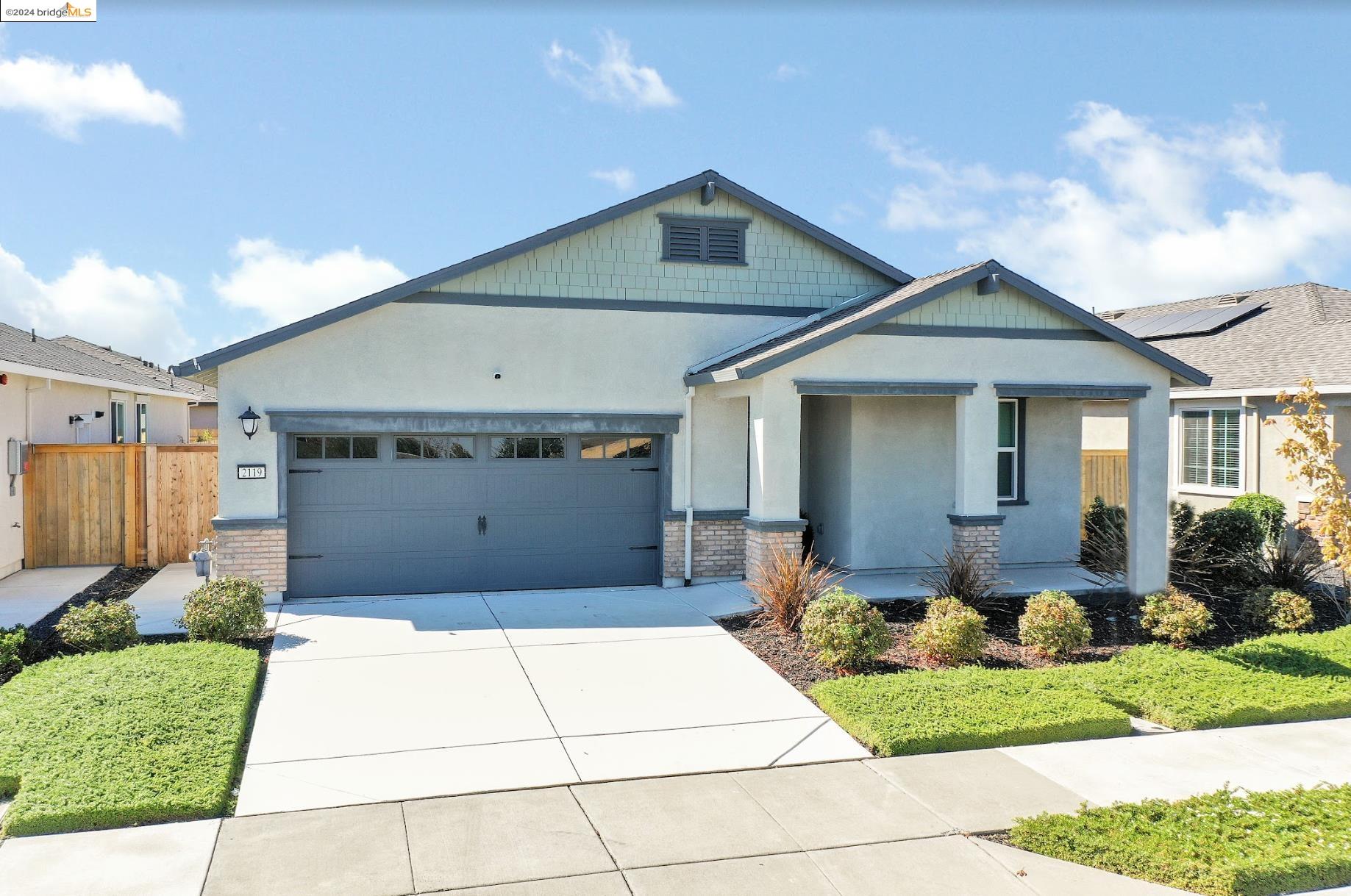 a front view of house with yard outdoor seating and barbeque oven