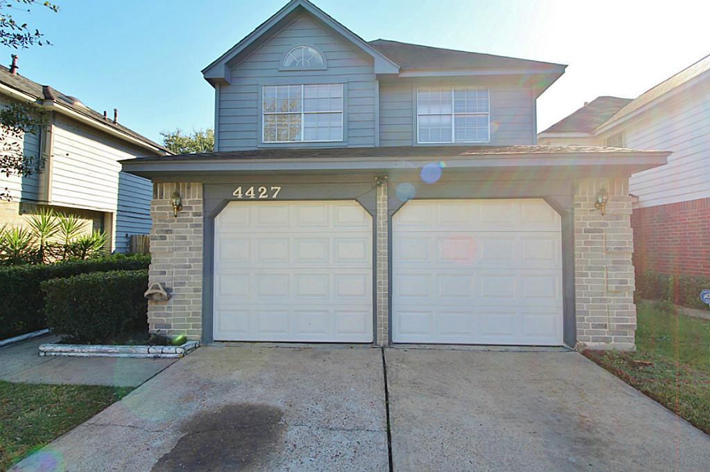 a view of a house with a garage