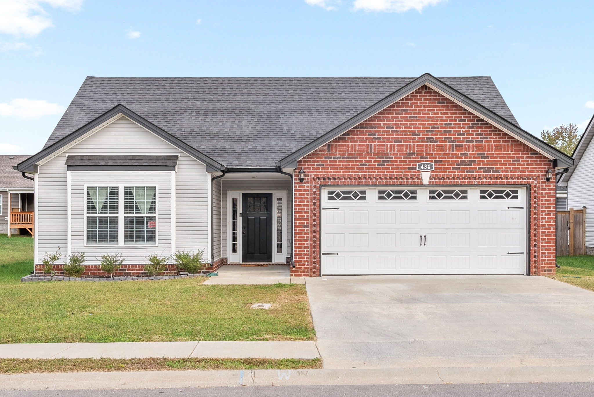 front view of a house with a yard