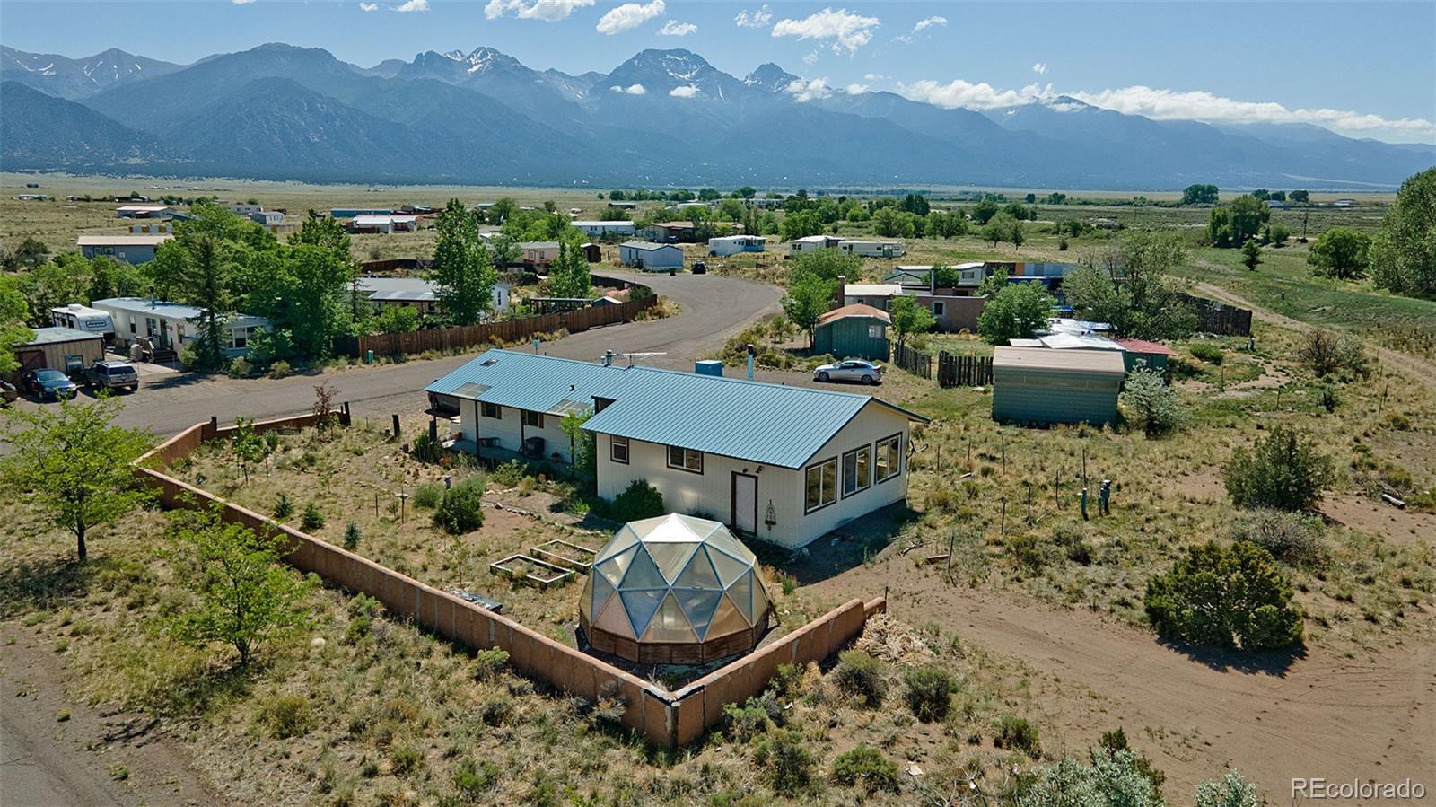 an aerial view of a house with a garden