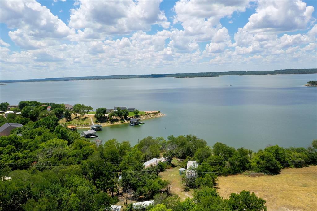 a view of a lake in middle of forest