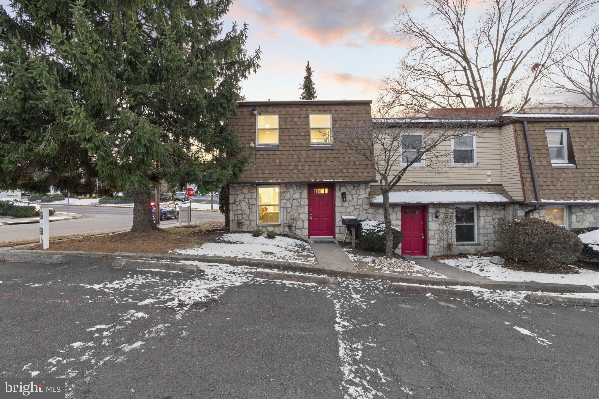 a front view of a house with yard