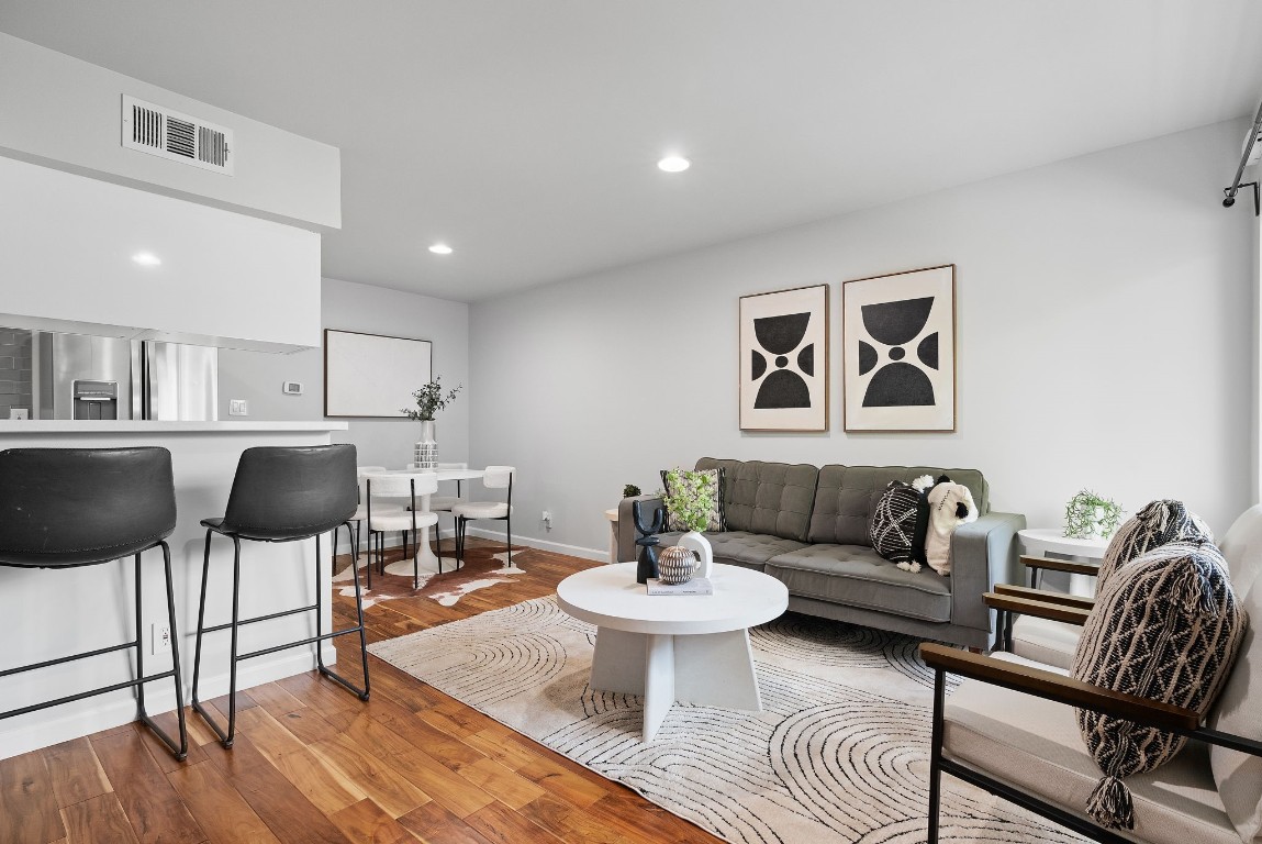 a living room with furniture and a table