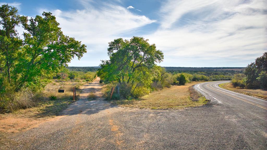 a view of a road with a yard