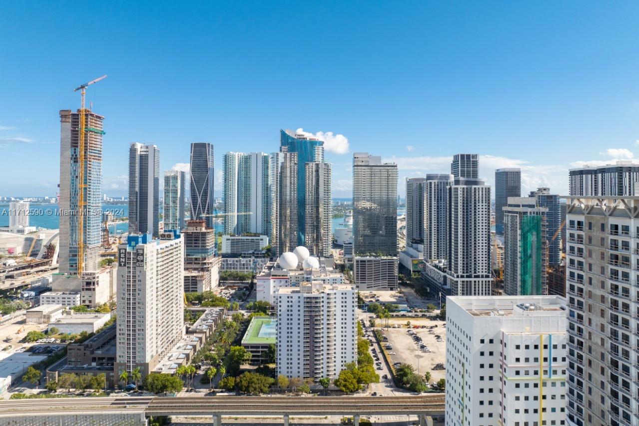 a view of city with tall buildings