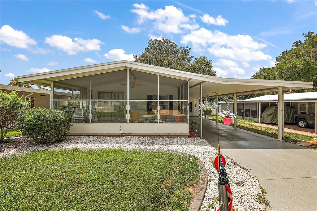 a view of a house with backyard