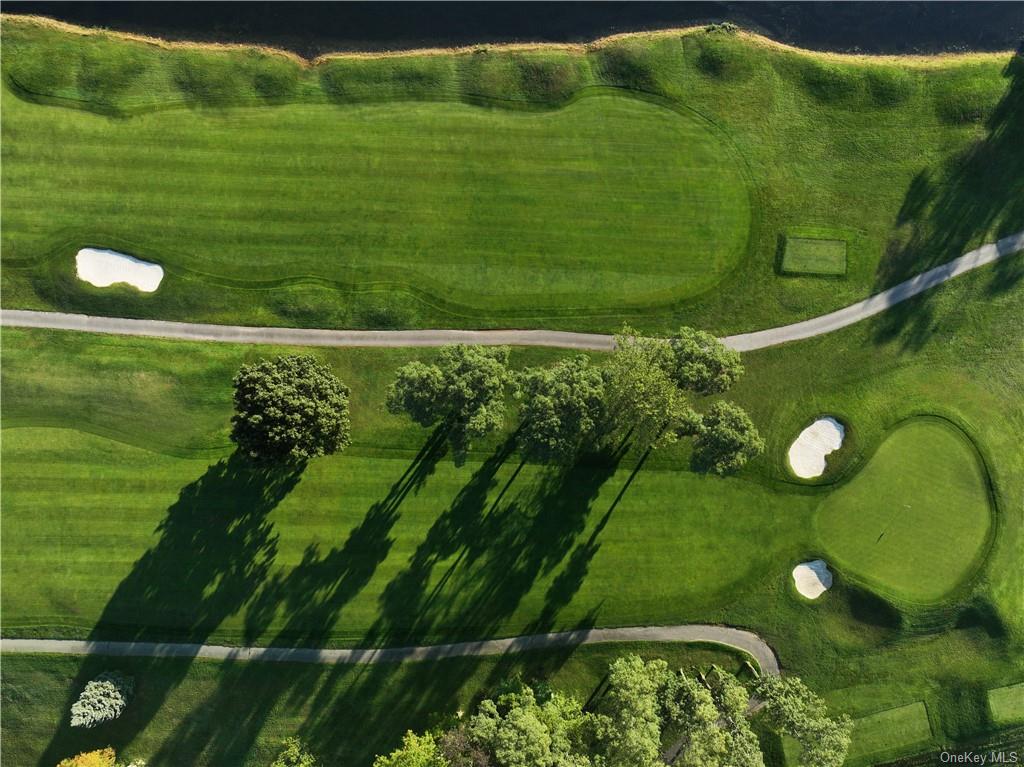 a view of a golf course with a garden