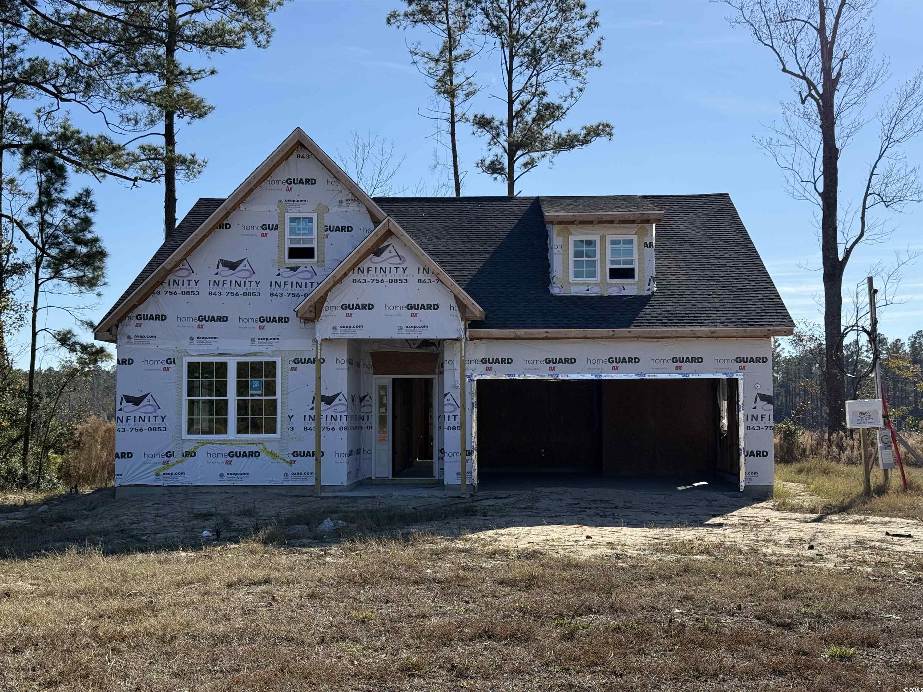 Property under construction featuring a garage and