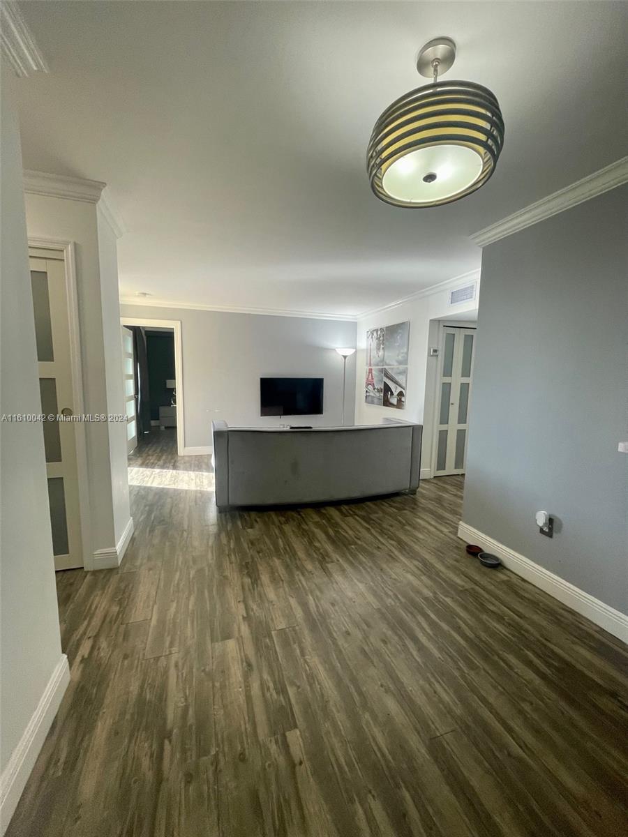 a view of kitchen and wooden floor